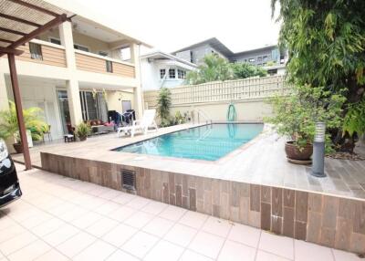 Outdoor pool area with seating