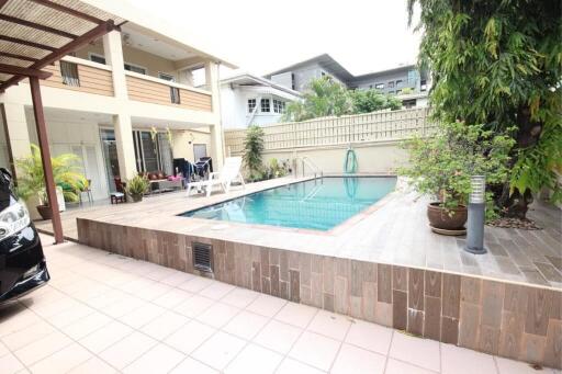 Outdoor pool area with seating