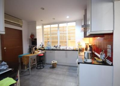 Modern kitchen with appliances and large window