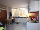 Modern kitchen with appliances and large window