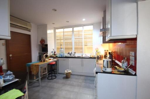 Modern kitchen with appliances and large window