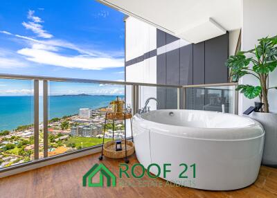 Spacious 2-Bedroom Corner Unit on the Highest Floor with Sea View & Balcony Jacuzzi—Steps from Jomtien Beach!