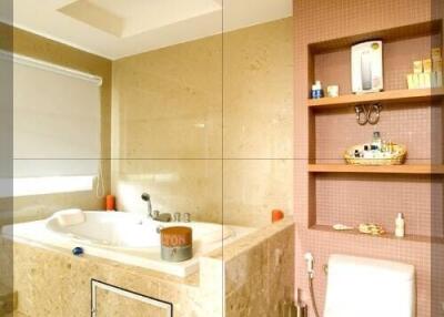 Luxury bathroom with bathtub and built-in shelves