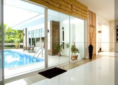 Outdoor patio area with pool view