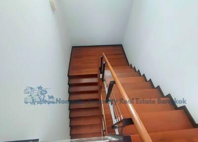 Wooden staircase with railing