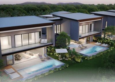 Aerial view of modern luxury villas with private pools and lush greenery