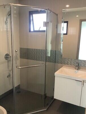 Modern bathroom with glass shower enclosure and vanity