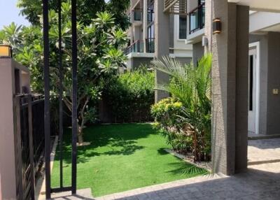 entrance to residential building with garden