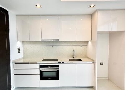 Modern white kitchen with integrated appliances