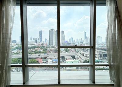 Large window with city view in a high-rise building