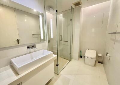 Modern bathroom with glass shower and sleek fixtures