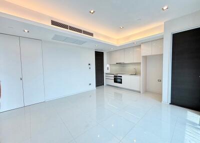 Modern kitchen with integrated appliances and bright lighting