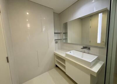 Modern bathroom with a large mirror and sink