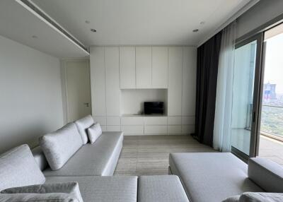 Modern living room with gray couches and large window