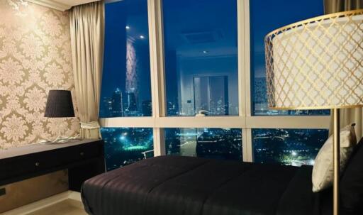 Luxurious bedroom with city skyline view