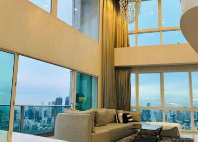 Spacious modern living room with large windows and city view