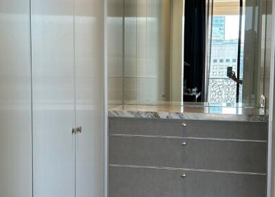 Spacious closet with modern cabinetry and a view of the city