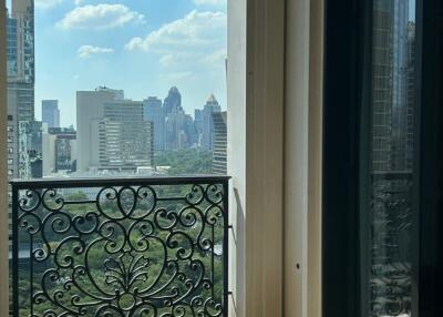 Balcony view with ornate railing and cityscape