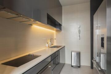 Modern kitchen with gray cabinets and stainless steel appliances