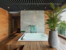 Luxurious indoor spa with hot tub and plant