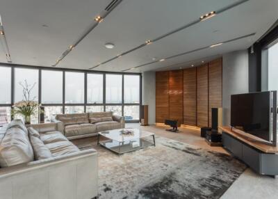 Modern living room with large windows and city view