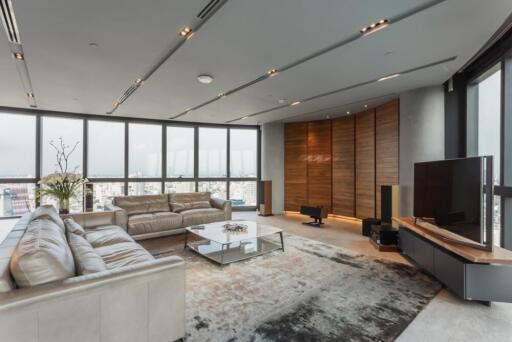 Modern living room with large windows and city view