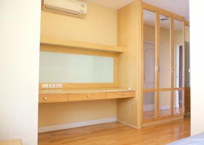 Bedroom with built-in desk and wardrobe