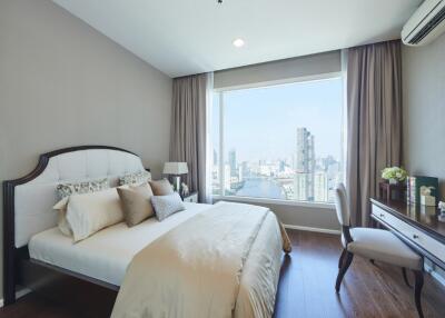 Well-lit bedroom with city view