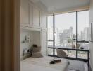 Modern bedroom with large windows and a city view