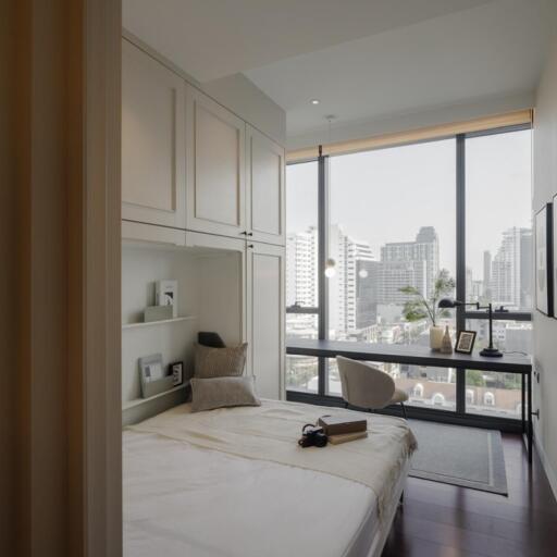 Modern bedroom with large windows and a city view