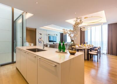 Modern open kitchen and dining area with elegant decor