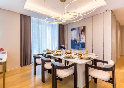 Modern dining room with elegant lighting and table settings