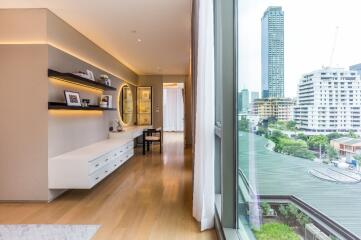 Modern bedroom with city view and built-in workspace