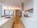 Modern kitchen with white cabinets and island