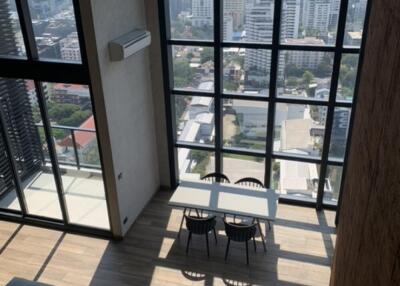 Living room with large windows and city view