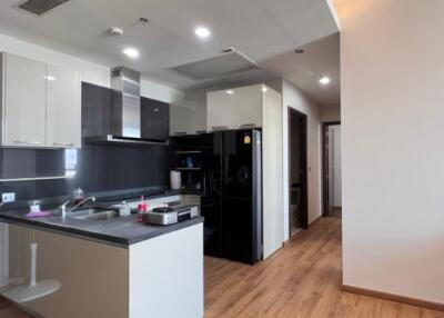 Modern kitchen with sleek appliances and wooden flooring