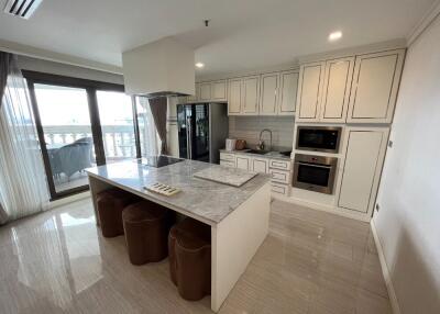 Modern kitchen with island and balcony access