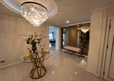 Hallway with modern decor and chandelier