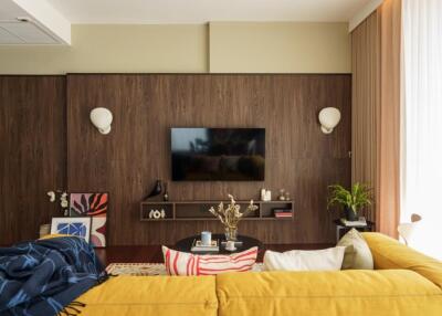 Modern living room with a wall-mounted TV and decorative elements