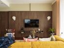 Modern living room with a wall-mounted TV and decorative elements