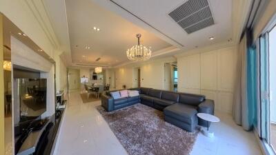 Spacious living room with modern furniture and a chandelier