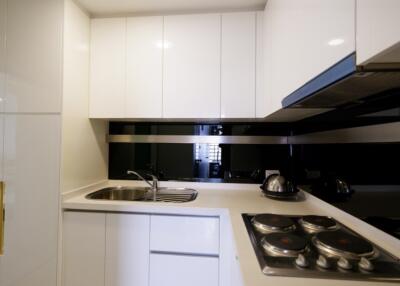 Modern white kitchen with built-in appliances