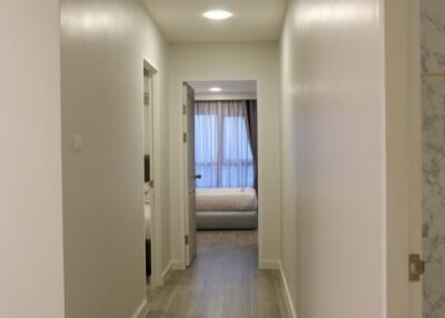 Long hallway leading to a bedroom