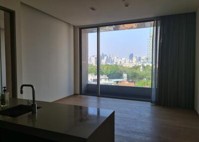 Living room with large window and city skyline view