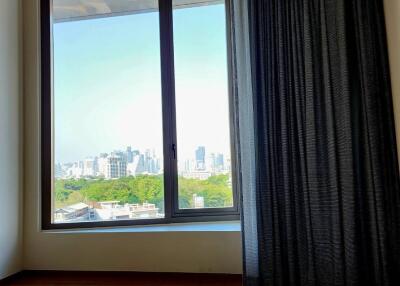 Living room with large window and city view