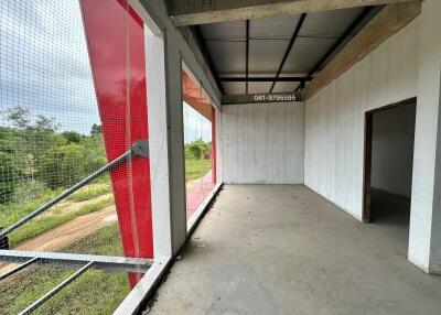 Empty room with large windows and forest view