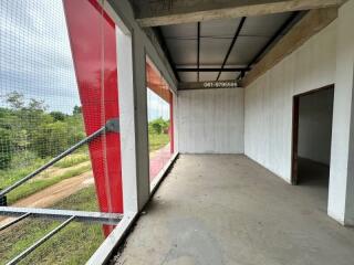 Empty room with large windows and forest view