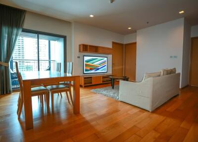 Spacious living room with modern furniture and a large TV