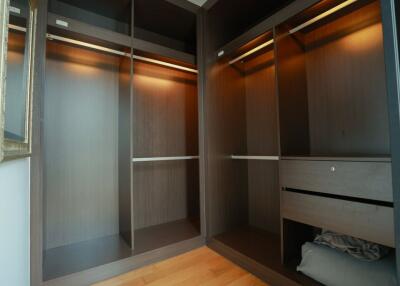 Spacious walk-in closet with multiple storage compartments