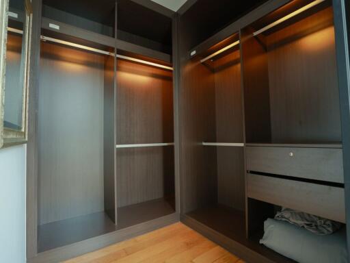 Spacious walk-in closet with multiple storage compartments